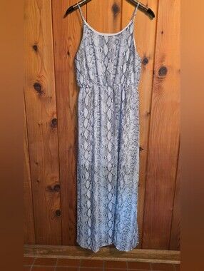 MTS brand maxi dress features a snakeskin print, spaghetti straps, and side slit